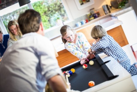 Pool dining tables for family spaces